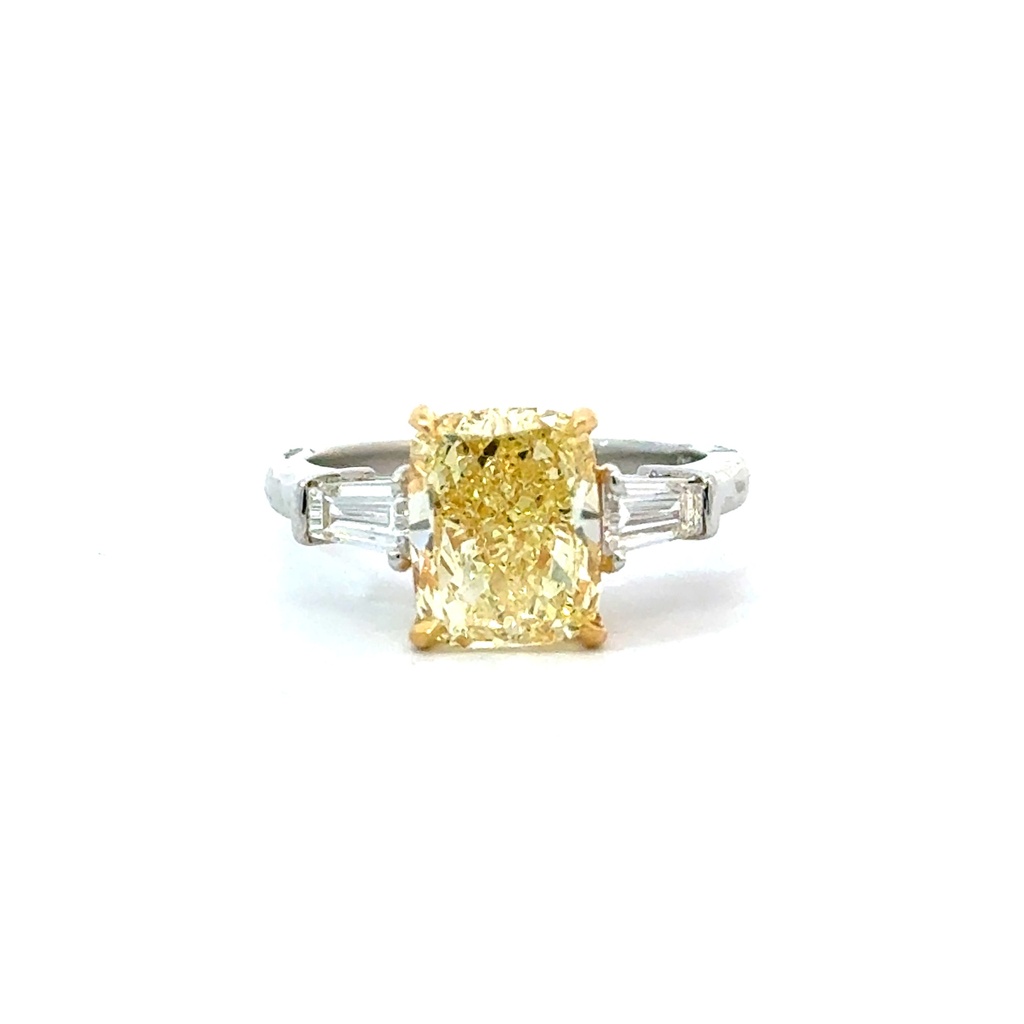 Platinum and 18Kt Yellow Gold Ring with A Cushion Cut Yellow Diamond Weighing 3.16ct And (2) Tapered Baguettes Weighing 0.45ct